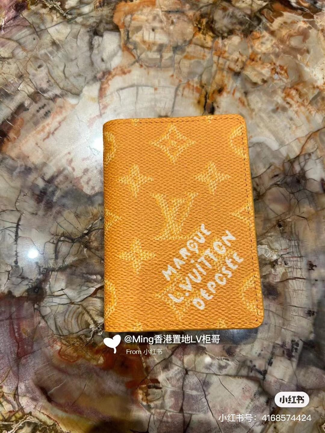 Louis Vuitton small wallet, orange monogram pattern with logo text on front