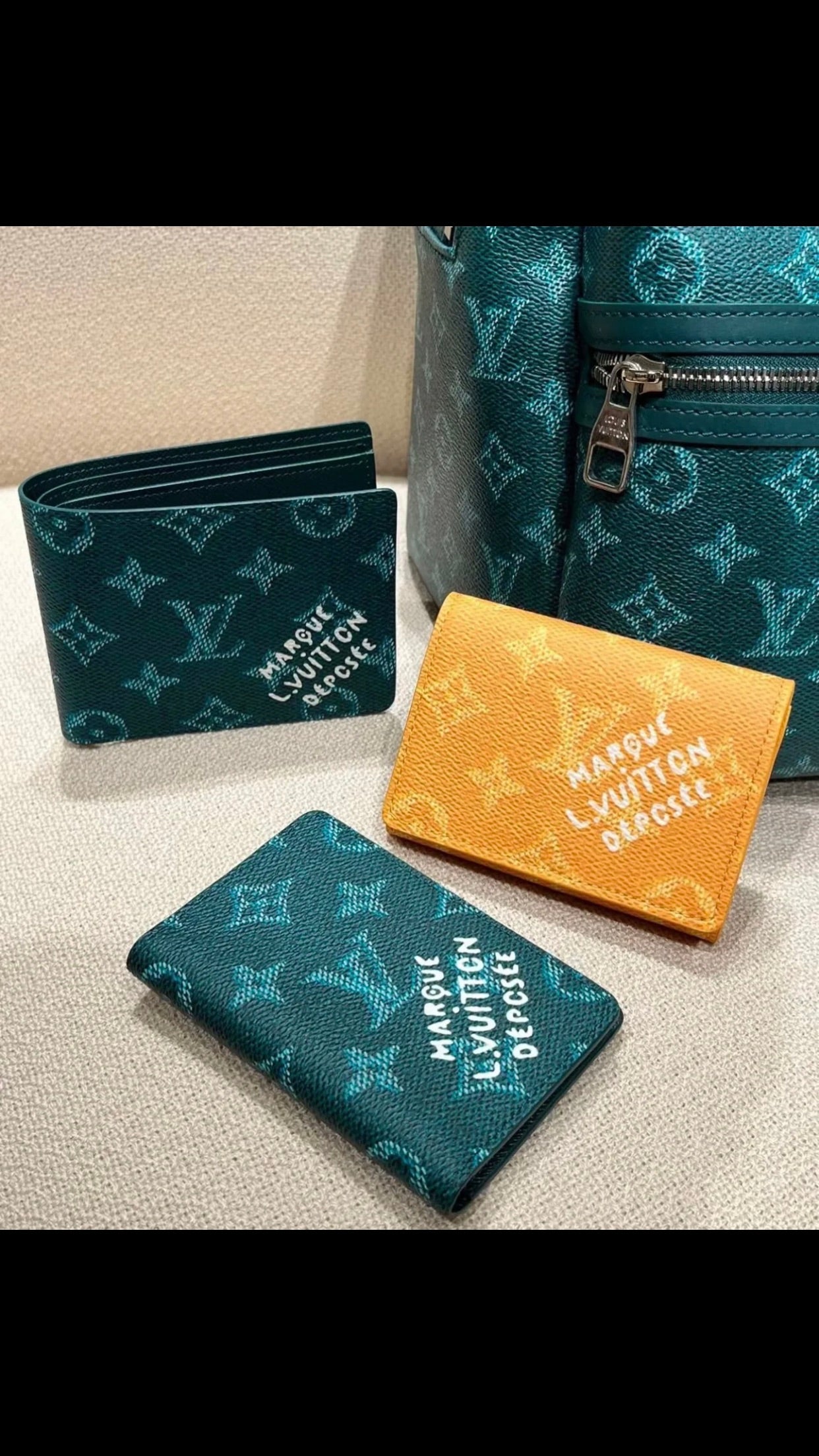 Small Louis Vuitton monogram small bag, teal with matching orange pouch and card case