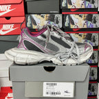 Grey mesh lace-up sneakers with purple trim, on box with white barcode label
