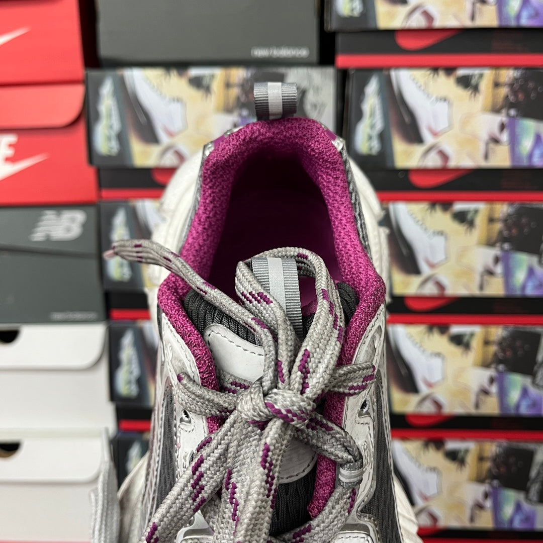 Grey lace-up sneakers with purple padded lining, close-up of collar opening