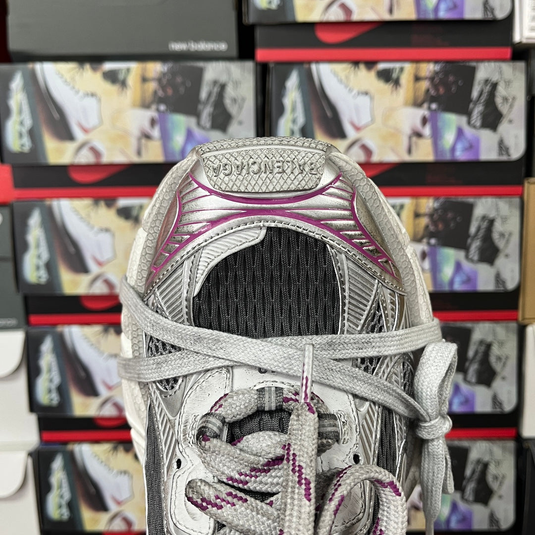 Grey mesh sneakers with purple collar and laces, tongue and upper heel opening view