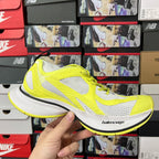 Neon yellow and white lace-up running shoes with mesh panels and black trim