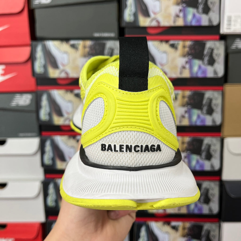 Neon yellow and white lace-up running shoe with black heel strap and BALENCIAGA text
