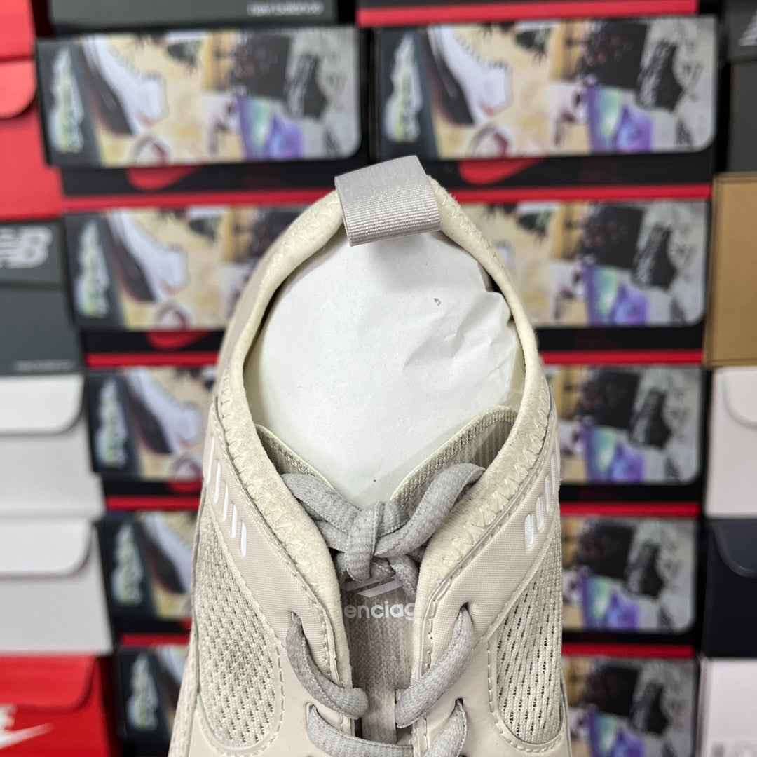 Cream sneaker tongue and collar with lace-up eyelets and padded heel