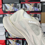 Cream lace-up sneaker with breathable mesh upper and thick ribbed midsole
