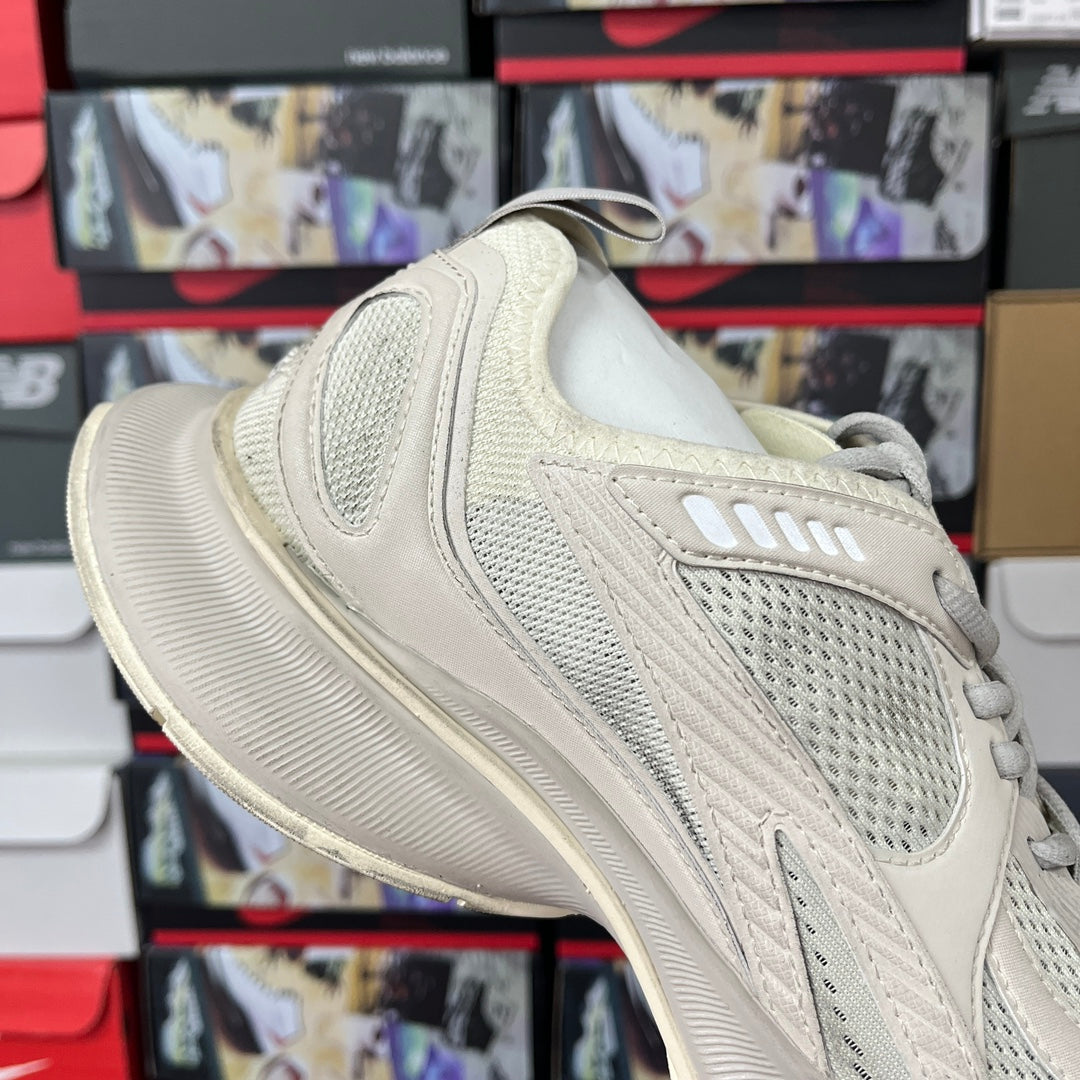 Cream lace-up sneaker with breathable mesh upper and thick ribbed midsole