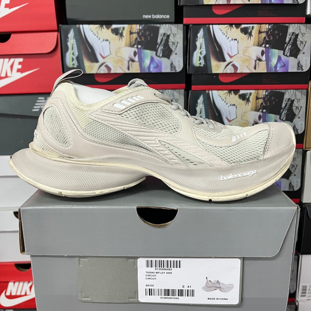 Cream lace-up sneaker with layered mesh upper and curved rubber sole