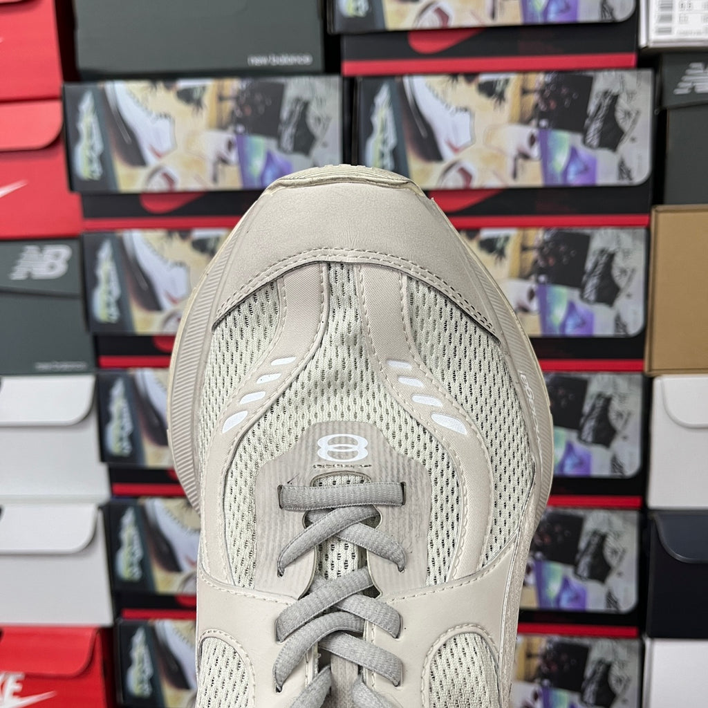 Cream sneaker heel with lace-up tongue and mesh paneling detail