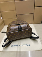 Monogram canvas backpack with top handle, front flap closure and crossbody strap