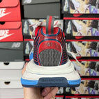 Balenciaga unisex running sneaker heel, red logo patch on navy upper with white laces