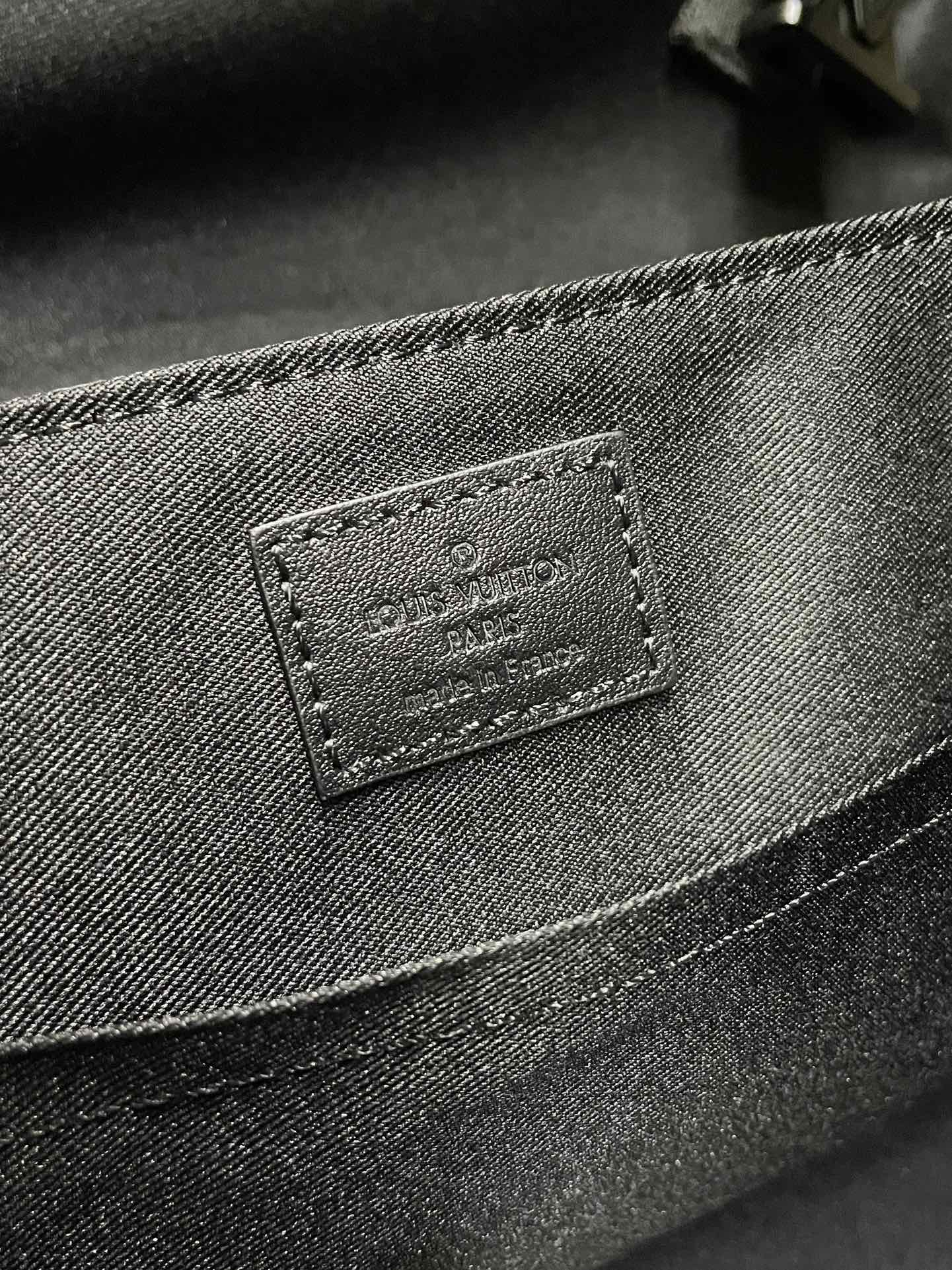 Men’s monogram bag close-up of rectangular leather label on front panel