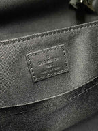 Louis Vuitton Paris leather brand patch on monogram bag front, dark gray