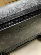 Men’s monogram bag close-up of zipper and embossed Louis Vuitton label on flap