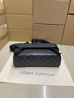 Men’s monogram crossbody bag front view with flap, top handle, and straps