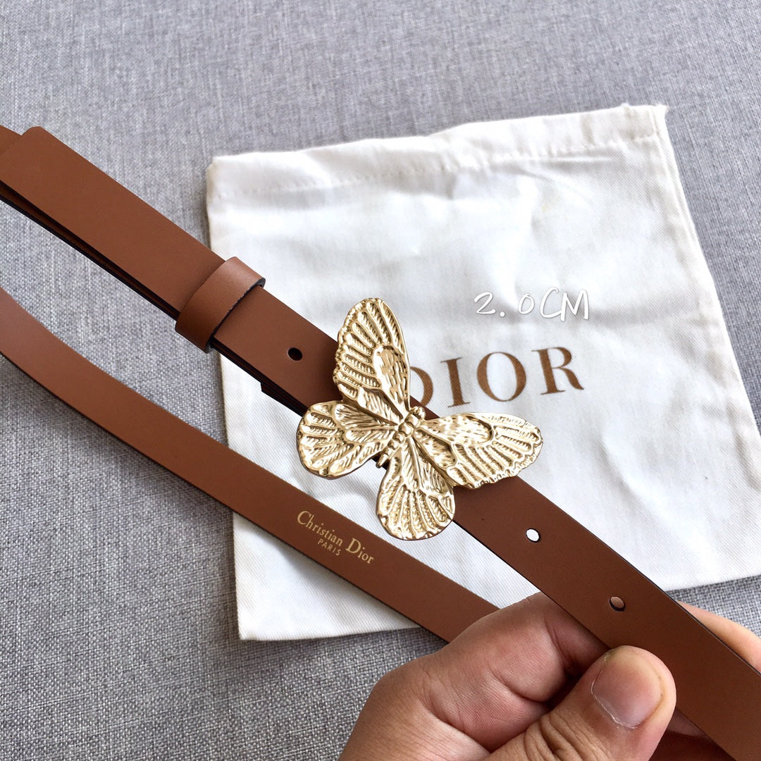 Dior brown leather belt with gold butterfly buckle and visible adjustment holes.