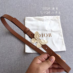 Dior belt in brown leather with gold butterfly buckle and engraved center emblem.