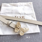 Light beige belt with gold butterfly buckle and pin closure, shown with dust pouch