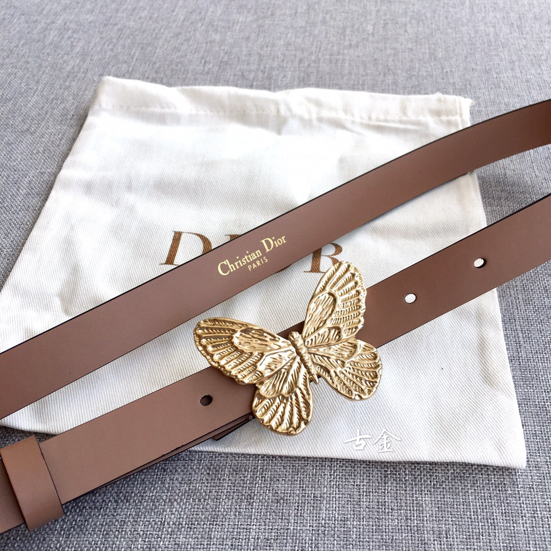 Dior belt with brown leather strap and ornate gold butterfly buckle centerpiece