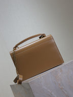 YSL tan top-handle bag with flap closure and gold chain strap