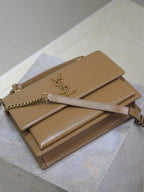YSL tan shoulder bag with YSL logo, double compartments, and gold chain strap