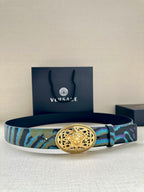 Versace belt with oval gold-tone buckle and blue-green patterned strap with dark edges