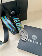 Versace belt with patterned blue-green strap and oval silver-tone buckle
