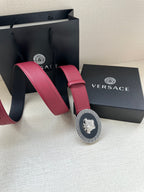 Versace maroon leather belt with round Greek key buckle and Medusa emblem