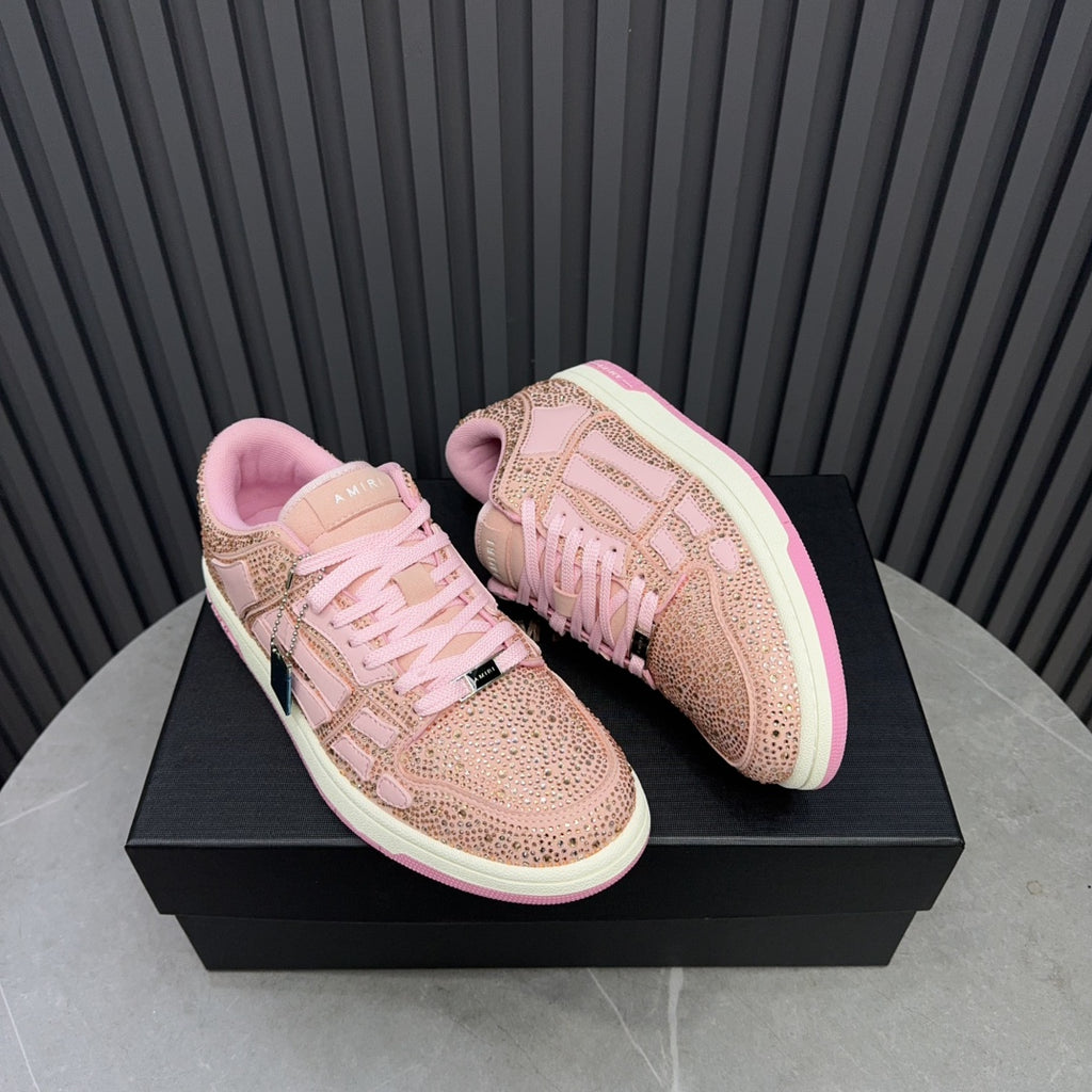 Amiri pink sequin lace-up sneakers shown as a pair on a box with pink sole