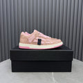 Amiri pink sequin lace-up sneakers with white side stripes and pink rubber sole