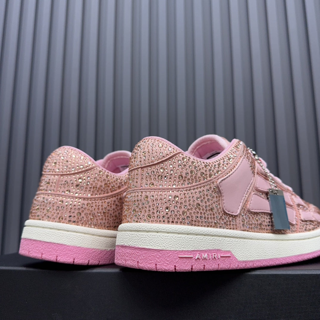 Amiri pink sequin sneakers showing heel and back, with AMIRI logo on the sole