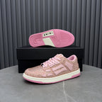 Amiri pink sequin sneakers with pink tread outsole on the box, lace-up front