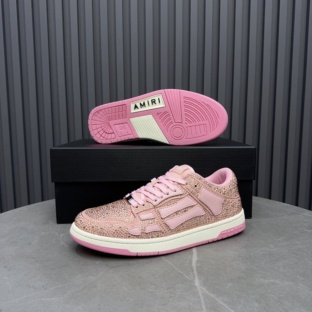 Amiri pink sequin sneakers with pink tread outsole on the box, lace-up front