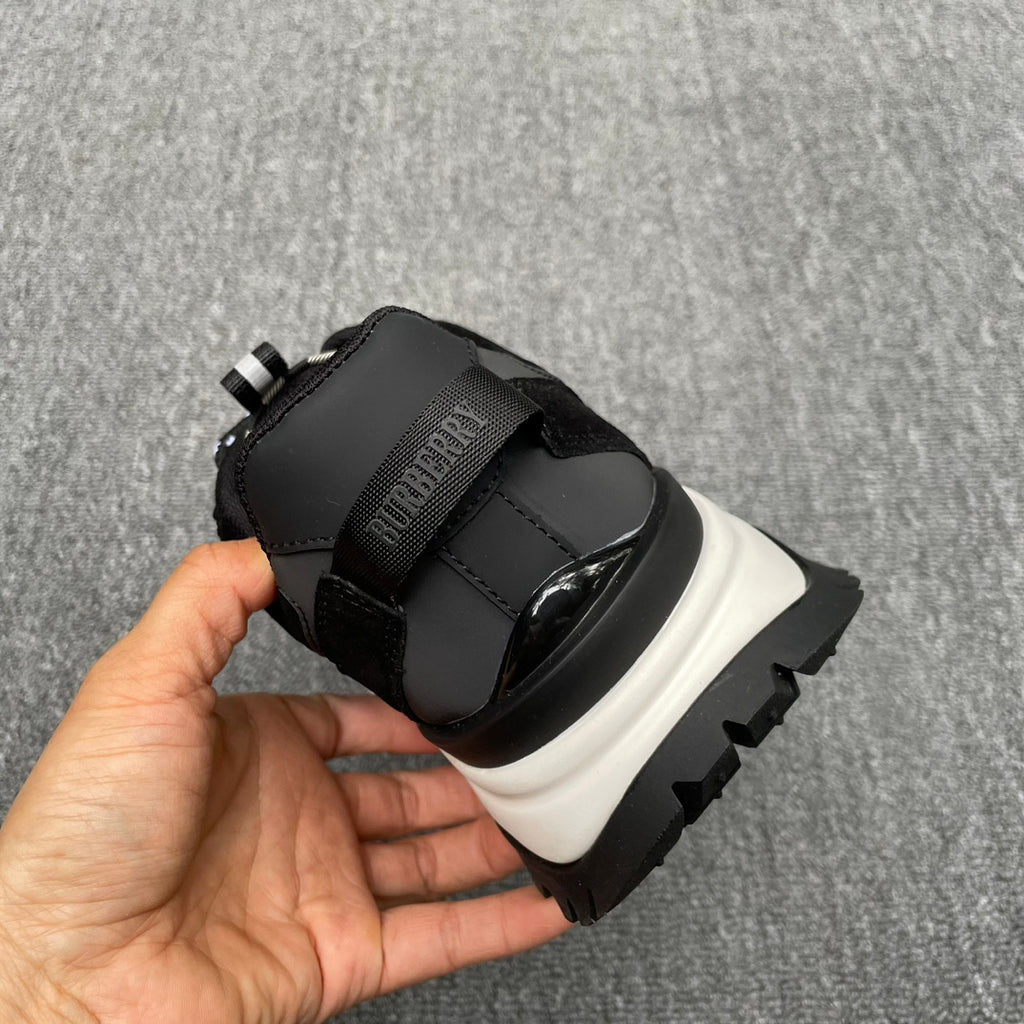 Black sneakers with beige check heel strap and chunky white sole