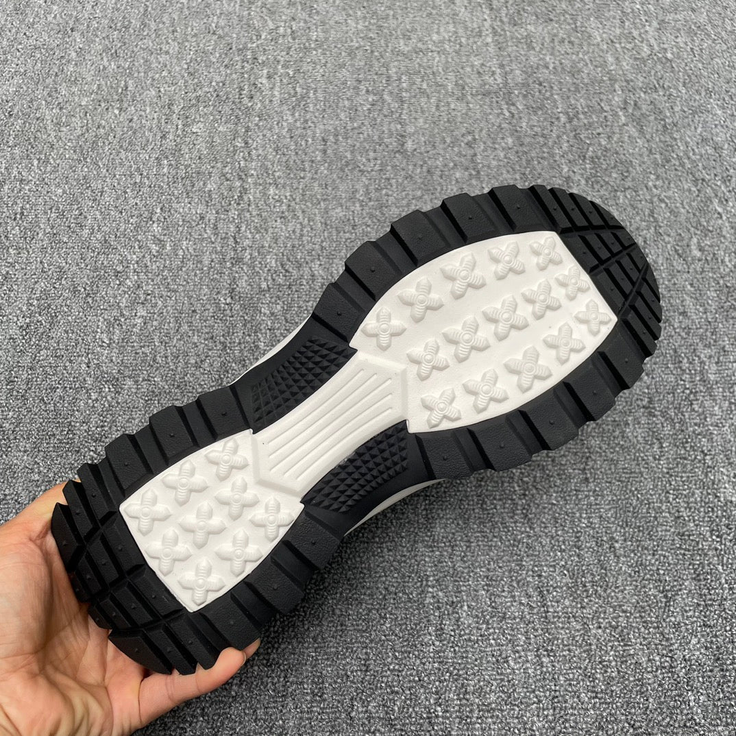 Black and white sneaker outsole with tread pattern and embossed grip texture