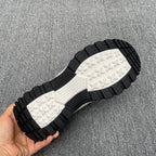 Burberry sneaker outsole tread, black rubber with white patterned traction