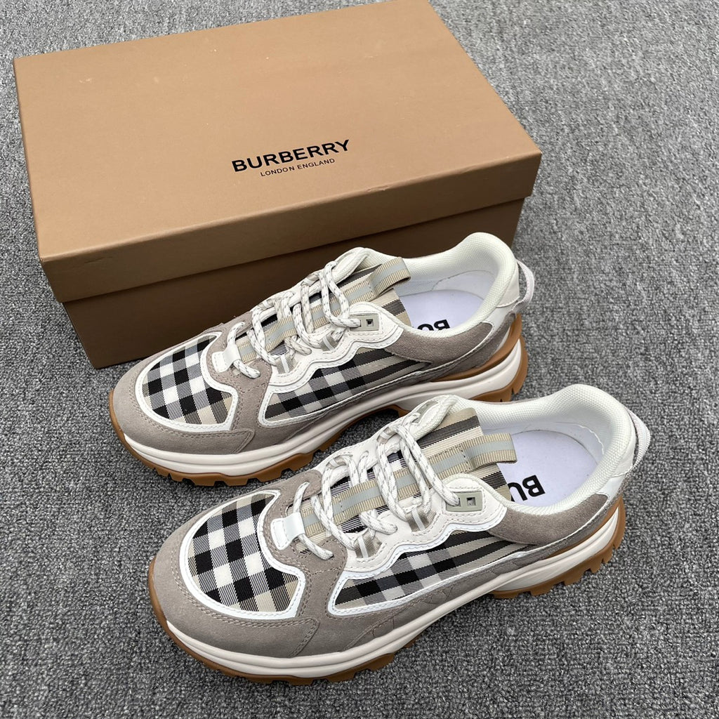 Gray low-top sneakers with black-and-white check panel, white laces, chunky gum sole