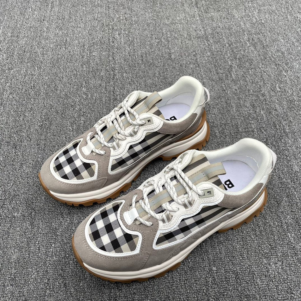Gray low-top sneakers with checkered side panels, white laces, thick sole