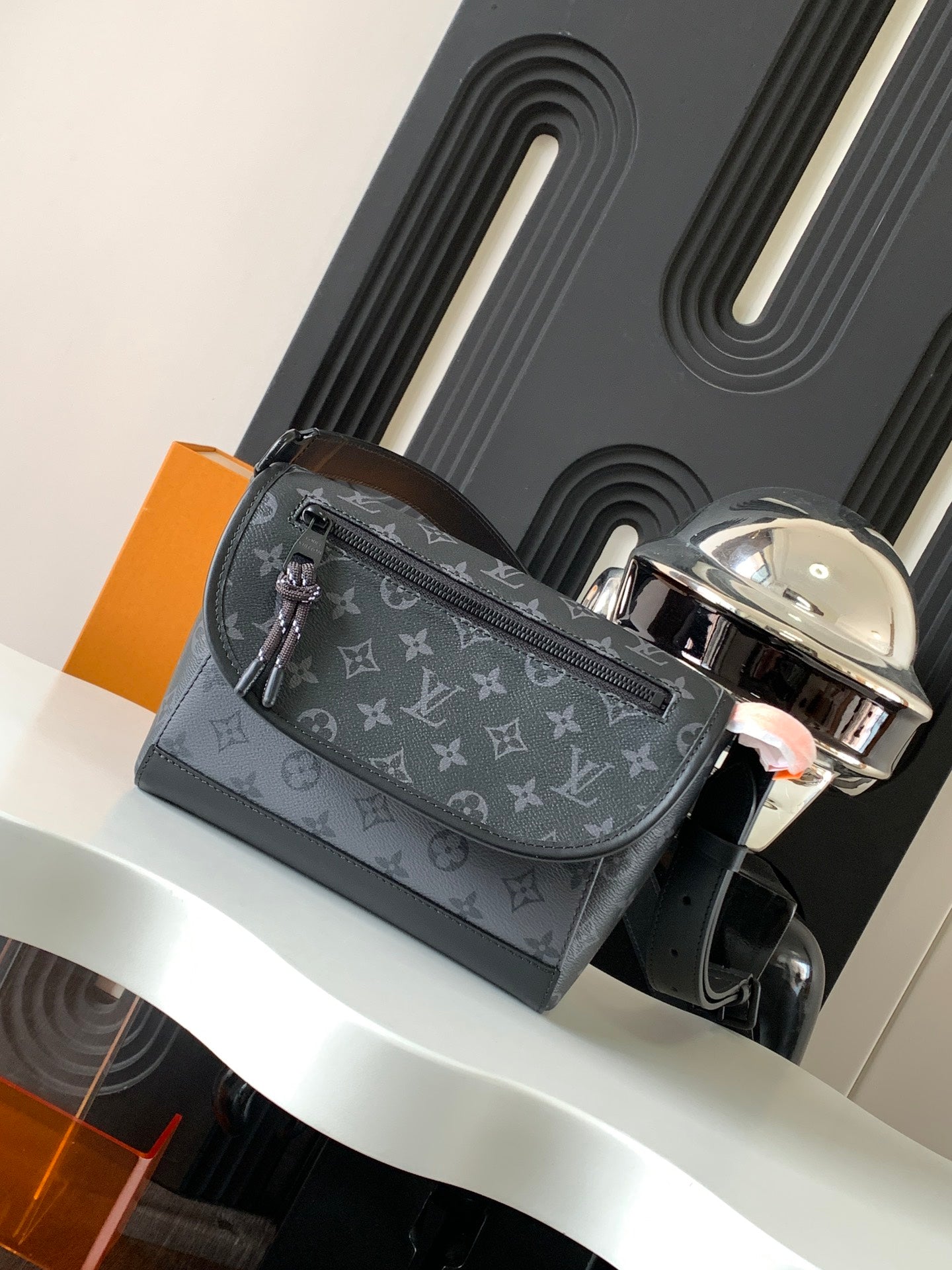 Louis Vuitton monogram crossbody bag with silver buckle strap and top zipper