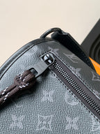 Louis Vuitton monogram bag close-up of zipper and engraved pull tab