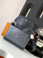 Louis Vuitton monogram crossbody bag with front flap, studs, and adjustable strap