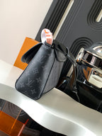 Louis Vuitton monogram crossbody bag with curved flap, top zipper, and shoulder strap