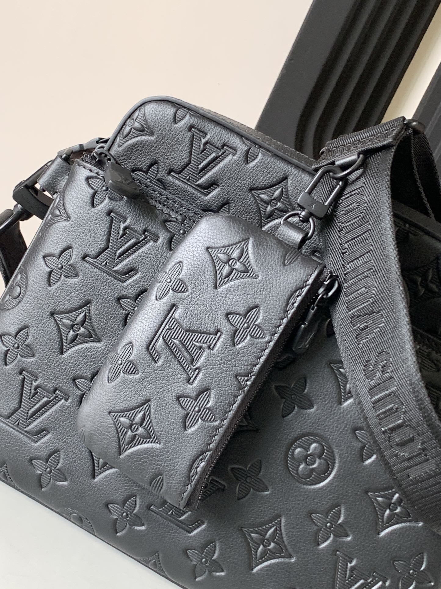 Louis Vuitton crossbody bag, dark gray monogram print with buckle strap detail