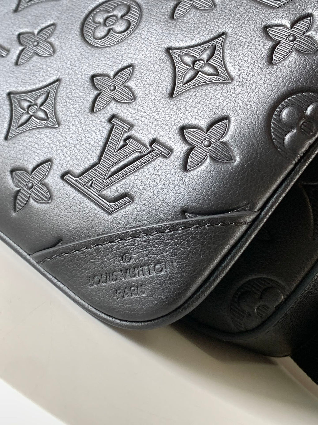Louis Vuitton embossed leather bag, dark gray monogram texture and stitched trim