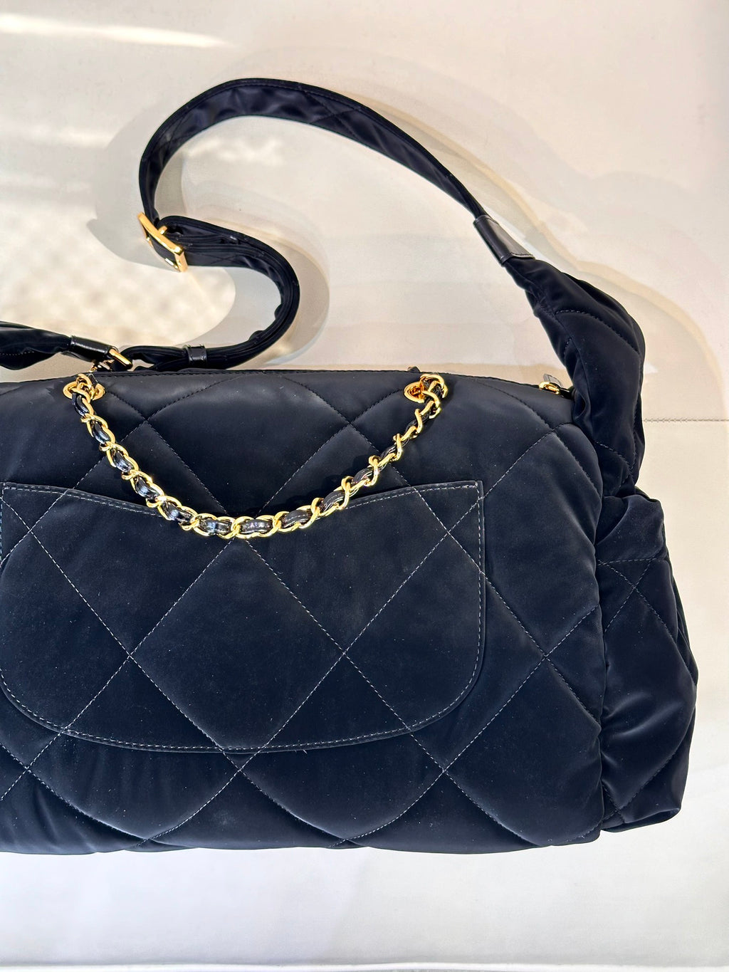 Chanel quilted shoulder bag in dark navy with gold chain strap and front flap