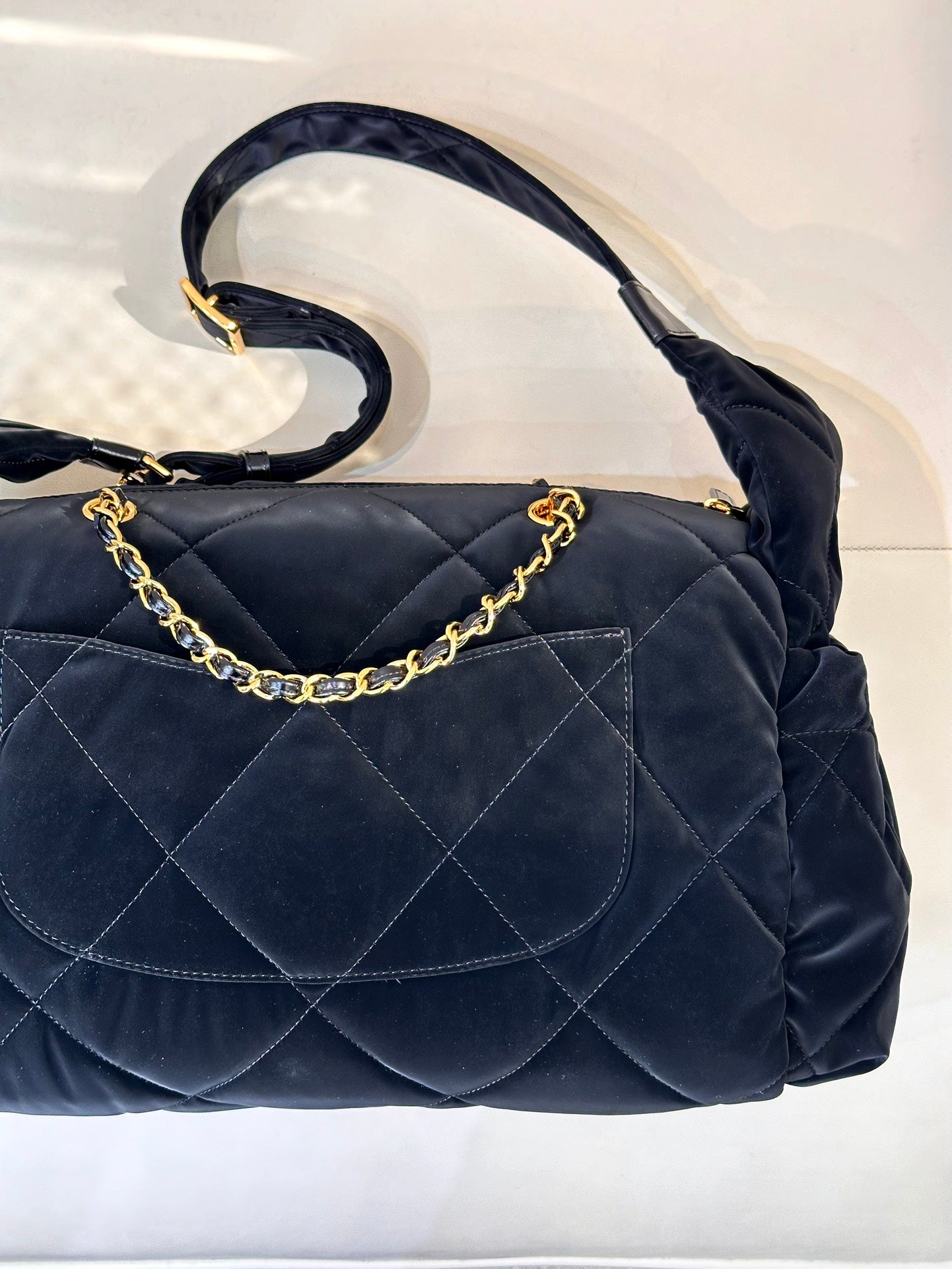 Chanel quilted shoulder bag in dark navy with gold chain strap and front flap