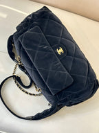 Chanel quilted shoulder bag in dark navy with pocket flap, gold chain and logo
