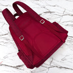 Gucci burgundy canvas tote bag with two handles, top flap pockets, and silver buckle tabs