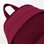 Gucci burgundy GG-pattern fabric panel on backpack with stitched seam