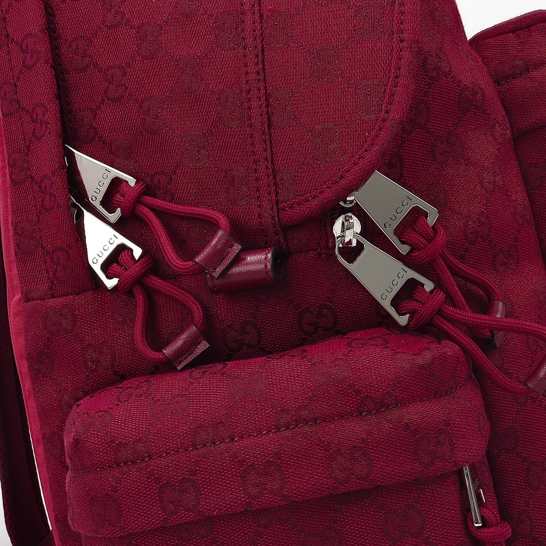Gucci burgundy backpack interior straps with buckle hardware and patterned lining