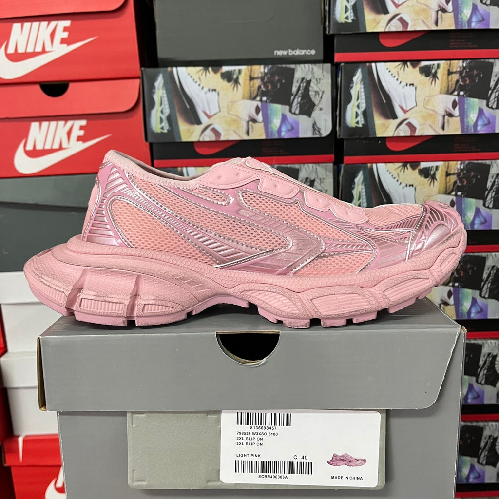 Pink Balenciaga unisex sneaker on box, side view with stitched logo detailing